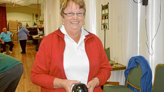 Joan Bailey from Cowra ready for a shot during the Grenfell Indoor Bowls Western Rivers District fundraiser tournament at the club last Sunday; 
