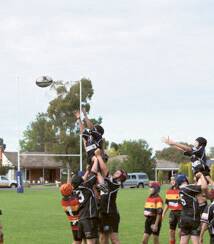 Jai Purdie and Josh Lebrocque lifting Fletcher Taylor in the line out against Coota 