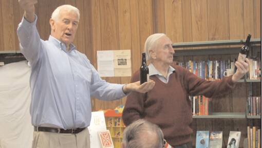 Entertaining the large crowd of seniors at the Library for the "Magical May Morning for Seniors" was magician Bill Nesbitt (l) and his helper (victim) from the crowd for this particular piece of magic, Keith Bolton. 