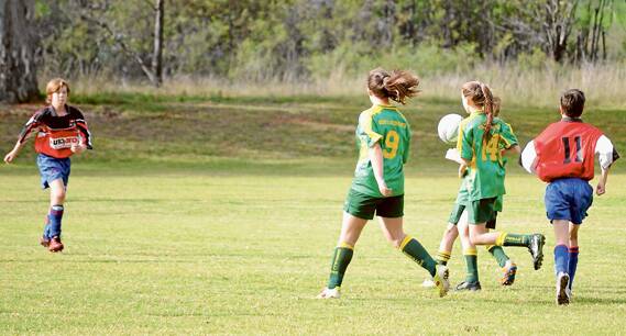 The Grenfell pony tails chasing the ball in the under 14’s game at Top Lawson Oval last Saturday. 