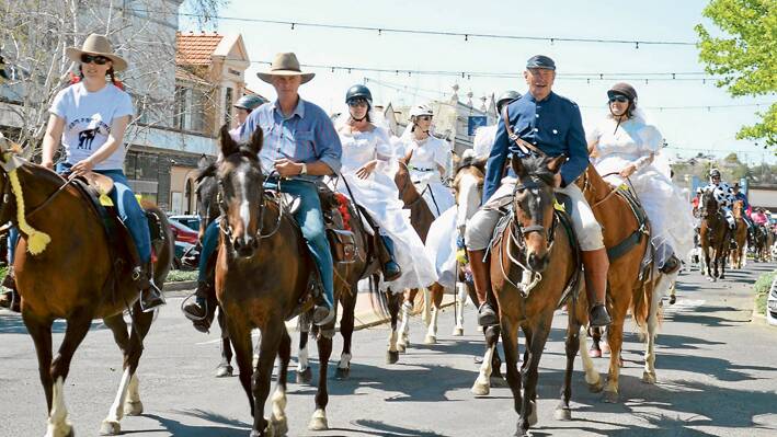 The Main Street parade in all of its colour as over a hundred riders bring the Muster to the public in 2013. 
