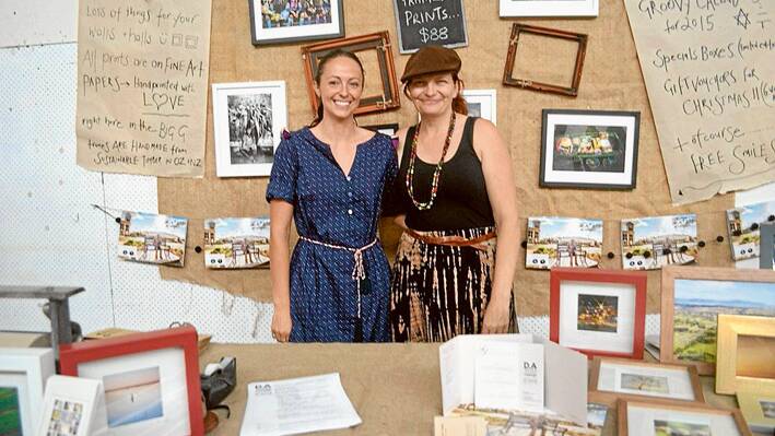 Local Business DA Yates Photography + Design's stall at the Twilight Markets was a big hit, pictured here are Denise Yates with staff member Claire Myers. 