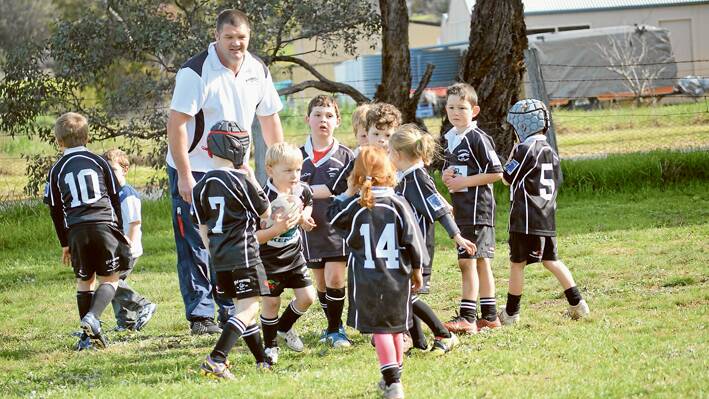 GALA DAY: Grenfell u/7’s coach Brad Robinson with his team before their kick off in the Gala Day at RB Bembrick Field on July 20, 2014. 