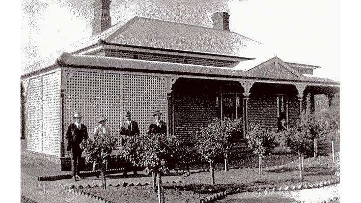This Grenfell home is built circa 1920 and this image is titled "Garden at Bogolong". 