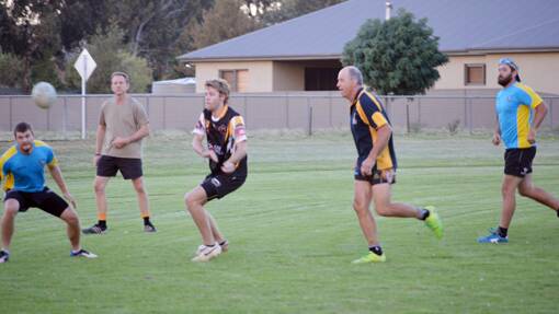 Action from the Touch Football grand final held on Monday, March 17, 2014. 