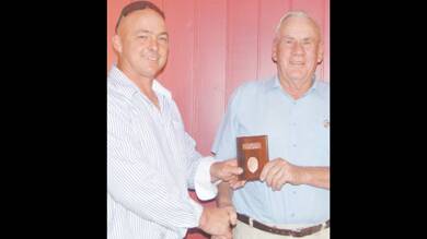 GRENFELL PAH&I SERVICE: PAH&I Society President, Mark Leibich presenting Maurice Simpson with a medallion recognising his 50 years service to the Society. 