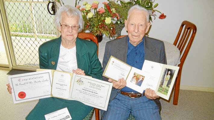 Dorothy and Ron Lamkin proudly displaying their many congratulation cards received on the occasion of their 60th Wedding Anniversary.
 