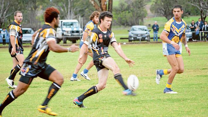 Dylan Beer puts toe to ball with Mana Aditagane in support in a recent game against Condobolin at Lawson Park.  