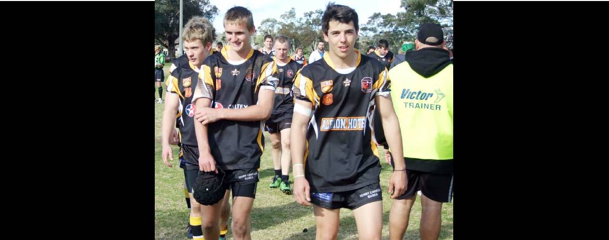 GOANNAS V CANOWINDRA: Grenfell Youth League players (l/r) including Shaun King, Daniel Harveyson and Mick Miller with Booby Ryan behind coming off for a well earned shower at full time after their tough win against Canowindra.