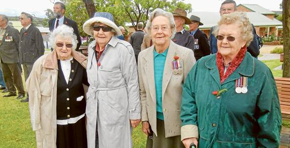Braving the wet and windy conditions at the Remembrance Day Service at Memorial Park on Monday were (L-R) Gene McNickle whose father served in the 1st World War, Meg Grant who was a Bombadeer in the Army and worked in the Artillary/Radar Department, Teddy Simpson (WAAAF) and Eunice Clarke who was a transport driver.