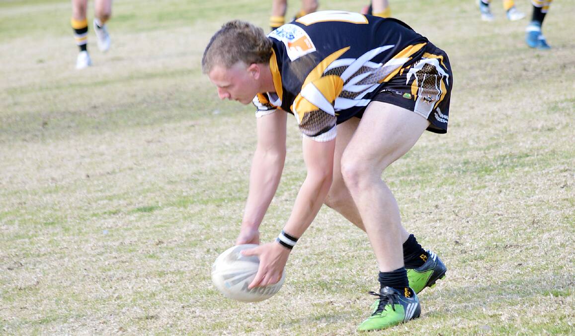 GOANNAS V CANOWINDRA: Grenfell Goannas Youth League player Bobby Ryan gets set to run with the ball in their game against Canowindra last Saturday at Lawson Park.
