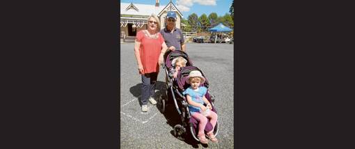 Proud grandparents Lynn and Steve Galvin enjoying the company of their grandchildren Casey and Jessie Pollock at the Lions Market Day.