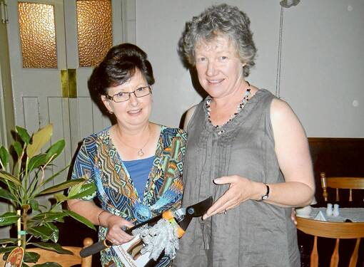 Joanne Simpson (L) who has been operating THLHS Canteen for many years being presented with an appreciation gift from Cath Sullivan when the School P & C hosted a farewell dinner for her.