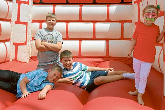 Great exercise - Luke Nealon, Harrison Starr, Caleb Haddin and Ruby Pickwell on the jumping castle at the Bowlies Kids Christmas party.
