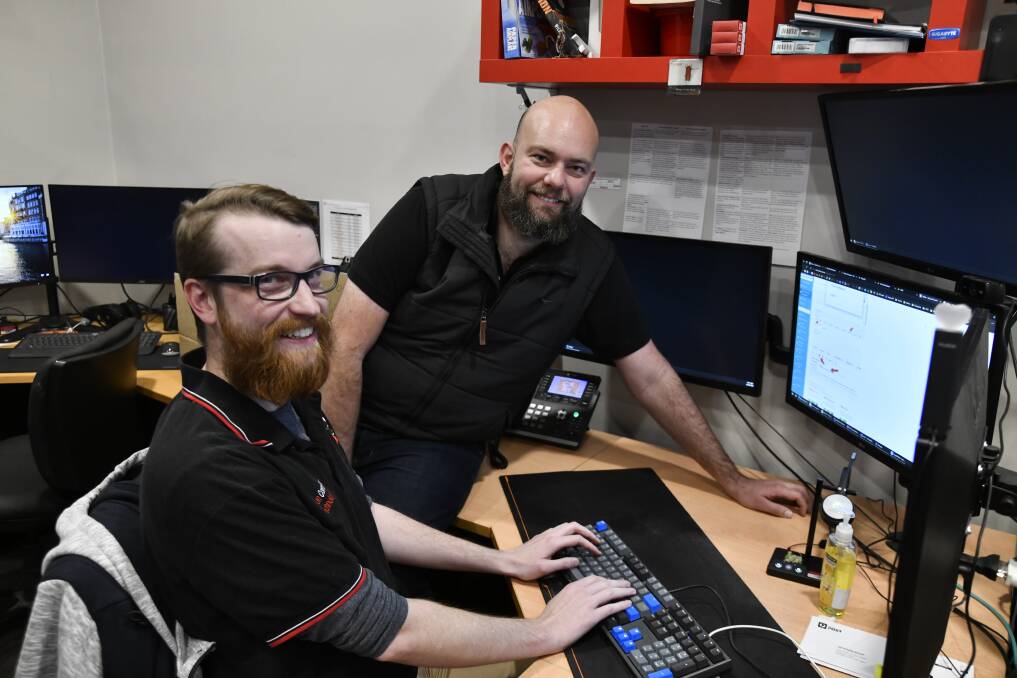 Colton Computer Technologies' Michael Carlisle with 'chief geek' Mitch Colton are pretty pumped for the 2023 Western NSW Business Awards. Picture by Carla Freedman.