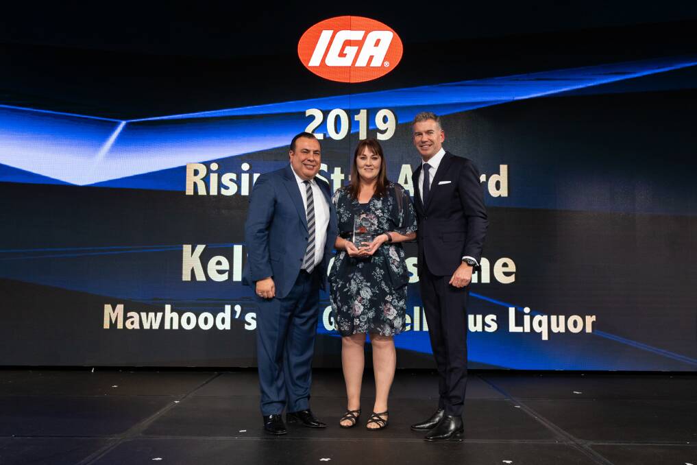 WHAT A WIN: Mawhood's IGA Grenfell plus Liquor manager Kellie Johnstone receiving her award on Tuesday night. Photo: Supplied.