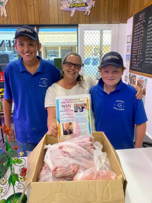 Rhys Hughes and Lee Ryan from Grenfell Meat Barn with winner Jude Bloomfield and her prize.