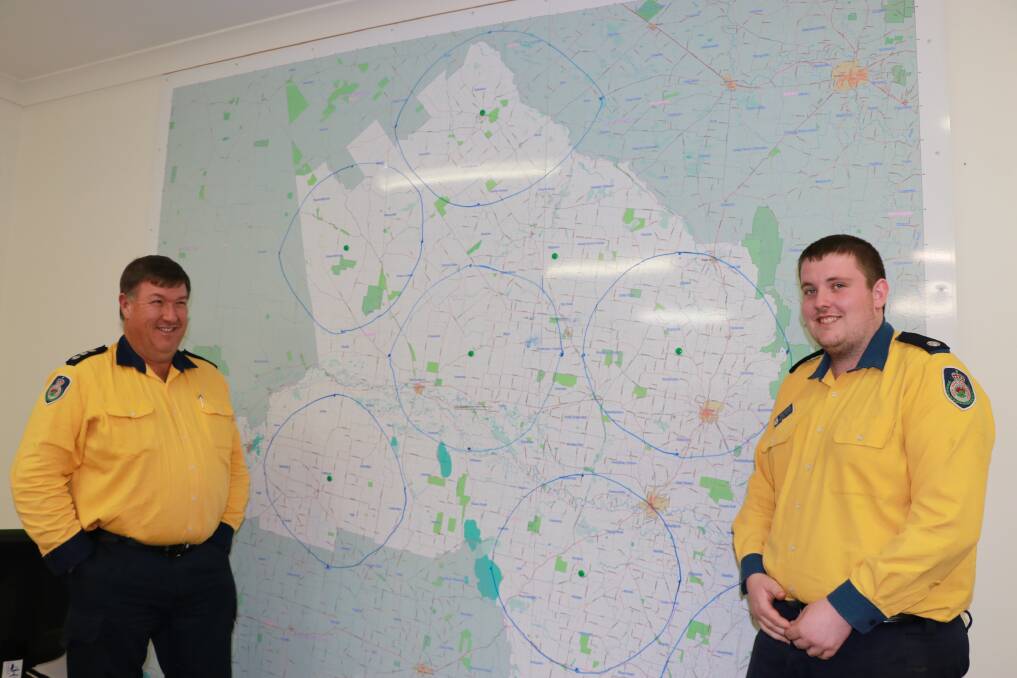 Forbes group captain Jeff House and RFS operational officer Jock Corcoran look over the map of the Mid Lachlan Valley region.