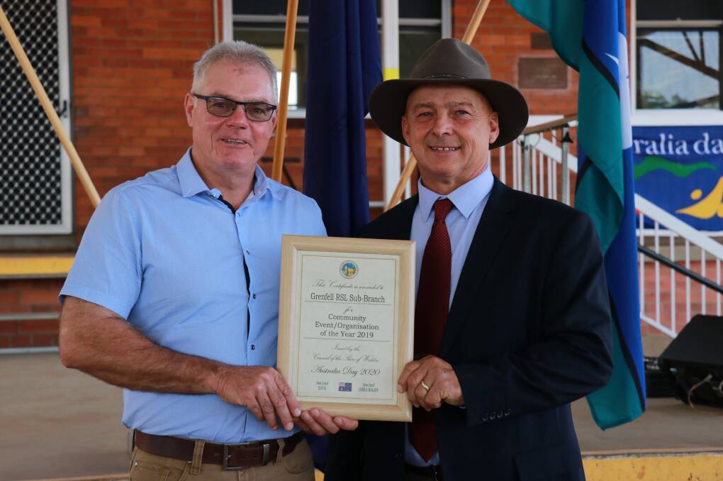 Grenfell RSL Sub Branch president Glen Ivins accepts the Community Group of the Year Award from Mayor Mark Liebich.