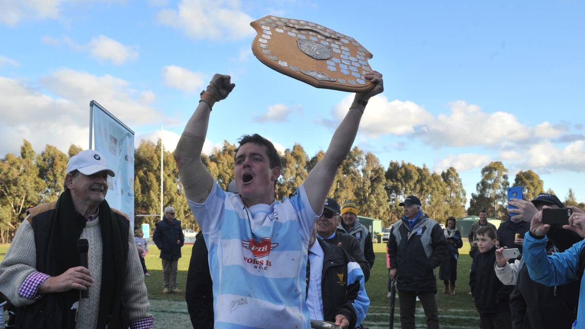 OH YEAH: Jack Hammond with the champions shield. Photo: JUDE KEOGH