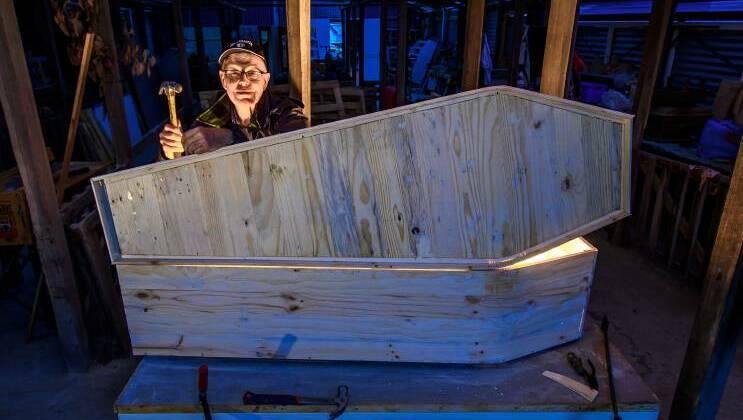 David Smith built coffins at the Ulverstone Coffin Club last year for himself and his wife, which he said taught him some new skills. They cost him virtually nothing as they were made from old pallets. Photo: Scott Gelston