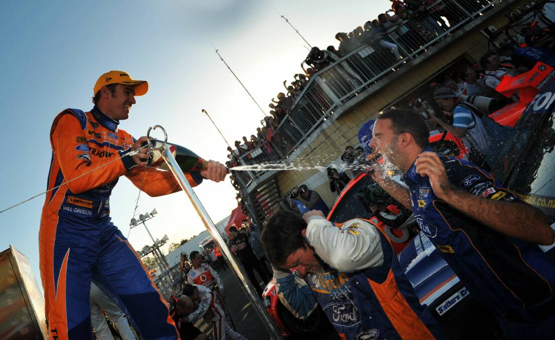 GOOD MEMORIES: Will Davison celebrates with his pit crew after topping the podium at Symmons Plains in 2012. Picture: Scott Gelston