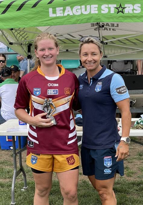 Taylor Keppie with Kylie Hilder. Taylor was named player of the match in the under 16s grand final.