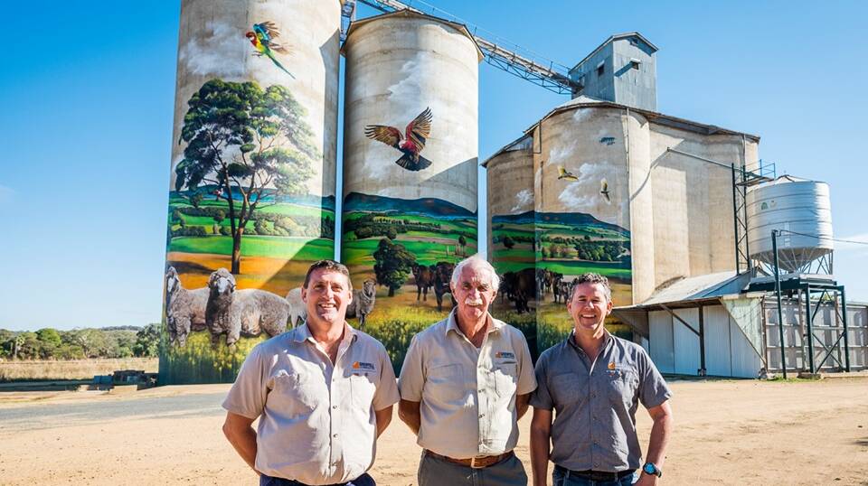 Trevor and Peter Mawhinney and Glenn Beasley in front of the Grenfell Silo Artwork which saw Grenfell Commodities receive a Weddin Shire Arts award.