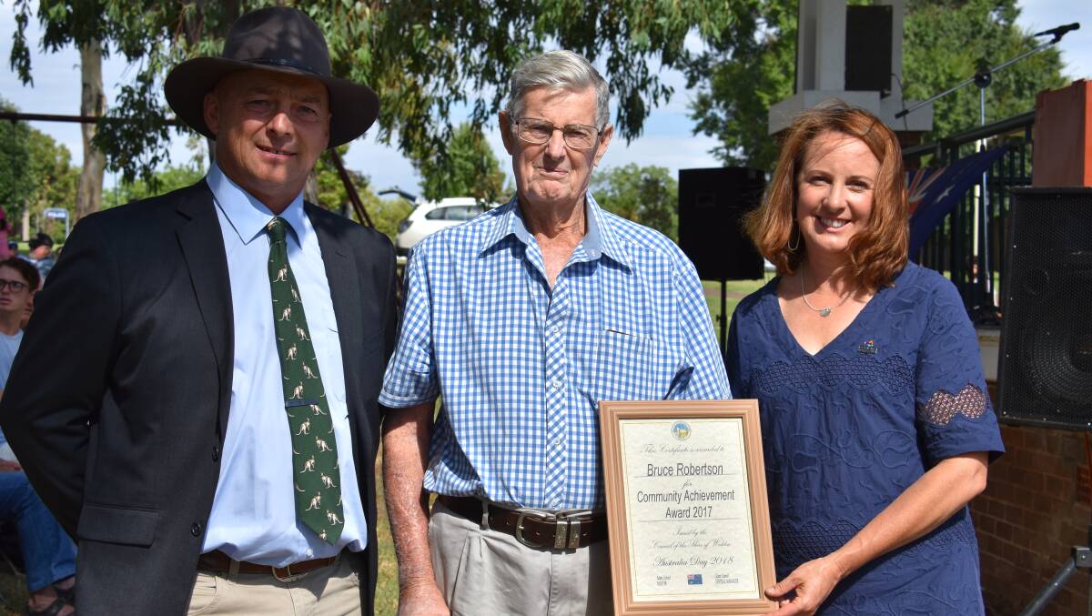 Community achievement award recipient Bruce Robinson (centre) with Weddin mayor Mark Liebich and Australia Day ambassador Sandra Ireson.