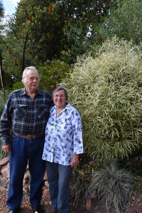 Noel and Sharon Cartwright in front of just a small section of their magnificent garden which will be open to the public on the weekend.