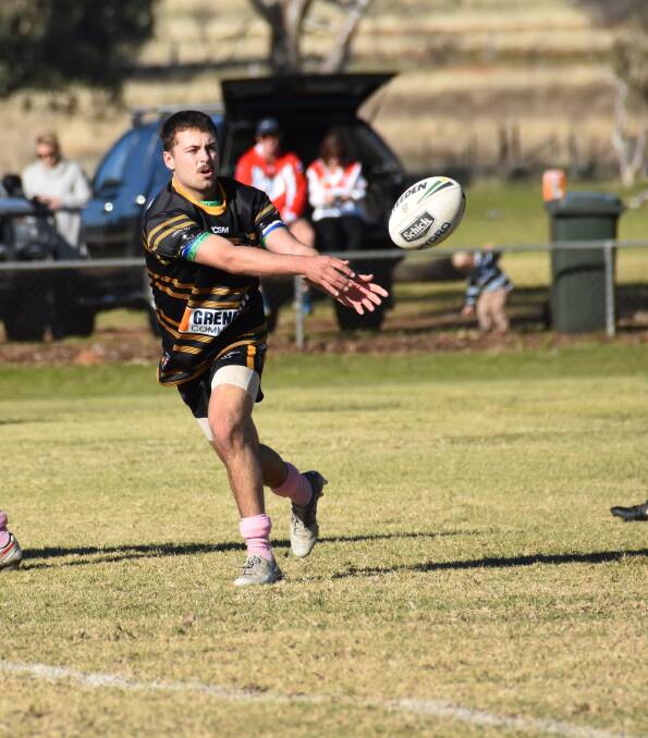 Ty Ashe fires off a pass to his supports in the Goannas win over Manildra on the weekend.
