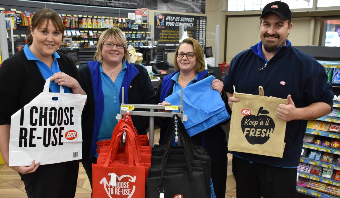 Kellie Johnstone, Melissa Perceval, Amber York and Ben Mitton with the new thicker reusable bag options at IGA.