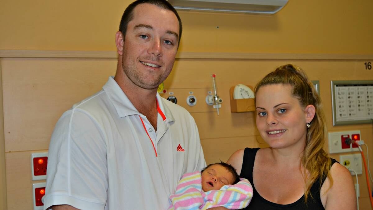 FIRST BABY: Andrew and Ashleigh Brown holding baby Indiana who was the first baby born in Young for 2017 and their first child. Picture: Craig Thomson.