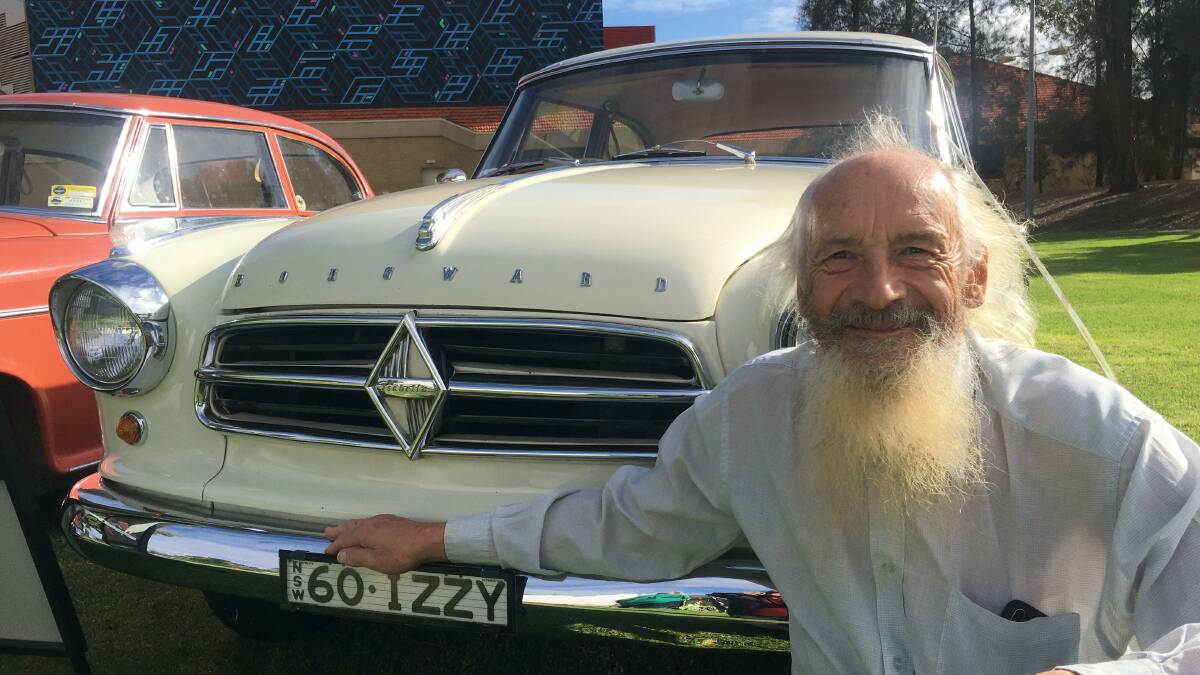 TIMELESS: Marius Venz poses with one of the Borgward cars displayed in Memorial Park. The display included an one-of-a-kind Goliath panel van.