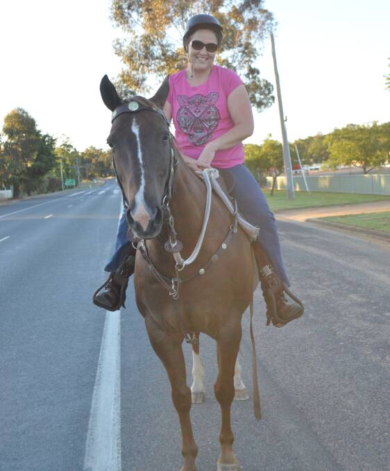 Kellie Johnstone of Grenfell enjoying a ride around town with 'Bullzye'.


