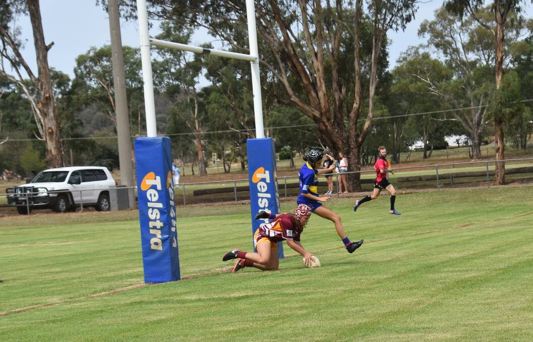 RUGBY LEAGUE: Libby Peshka scores under the posts for Woodbridge U15's in last Saturday's game at Lawson Oval. 