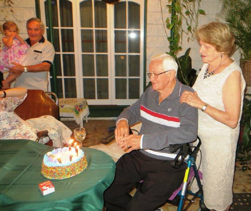 Marty Kelly about to cut his 90th birthday cake with his wife Carmel. (Cont) 