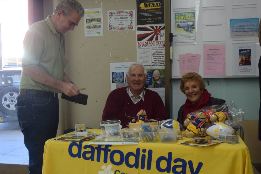 Nevin and Verona Hughes with customer Ray Cawthorne on Daffodil Day, August 25,  2017.