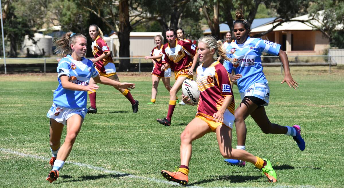 Isabelle Holz, Bridget Baker and Breanna Anderson represented Grenfell in the U18s Woodbridge Cup women's tackle footy last weekend at Lawson Oval while Caitlin Dixon, also of Grenfell, played in the open side.  
