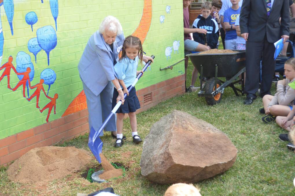 Youngest student Claire Brenner with eldest returning student Dot Lamkin during the time capsule internment.