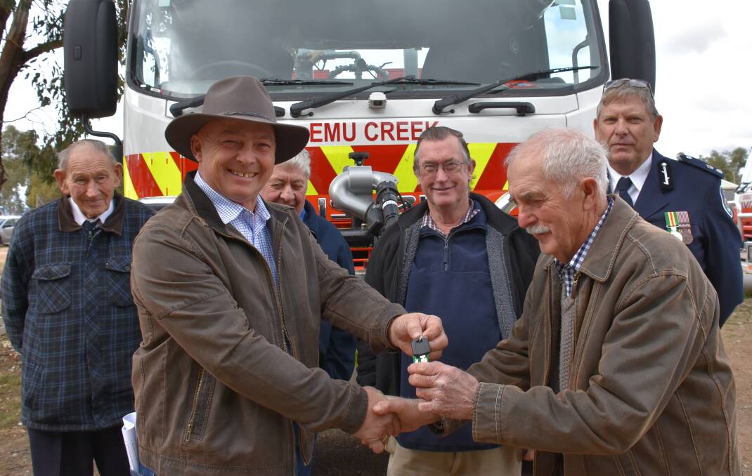 Graham Grimm receives the keys to Emu Creek's brand new tanker from Mayor Mark Liebich with Wally Gam, Ken Edwards, Stan Hazell and RFS Supt. Ken Neville.