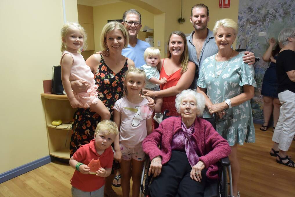 Pat Aston surrounded by her family at her 90th birthday celebrations. 