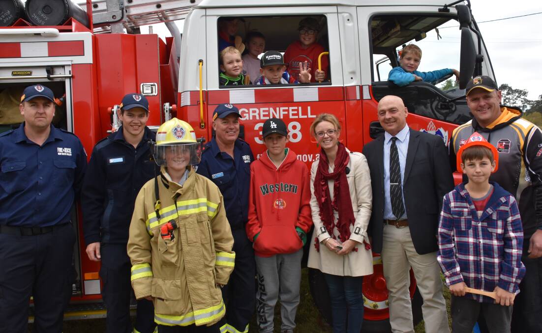 Member for Cootamundra Steph Cooke with Weddin Shire Mayor Mark Liebich, Grenfell Fire Fighters and local children during the Fire and Rescue NSW Grenfell open day at Lawson Oval. 