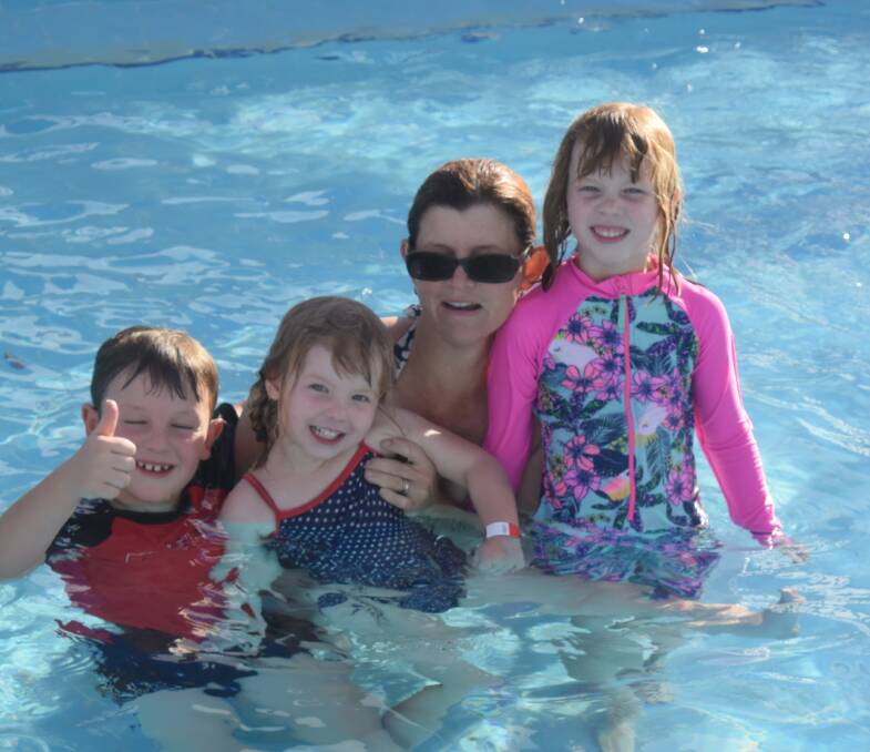 Amanda Prothero and her children Jack, Emily and Isabella Cooling off at the pool. 