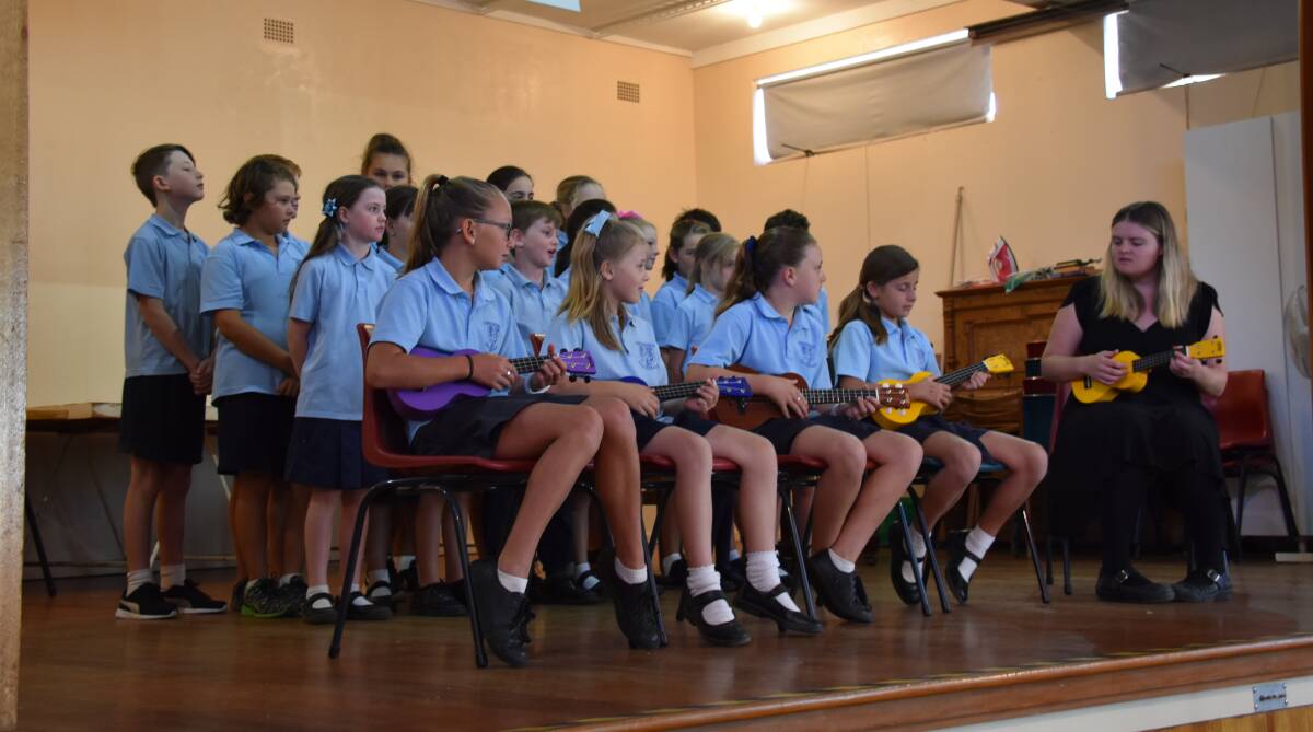 The Grenfell Public School ukulele band and choir at the 2018 Seniors Week morning tea. 