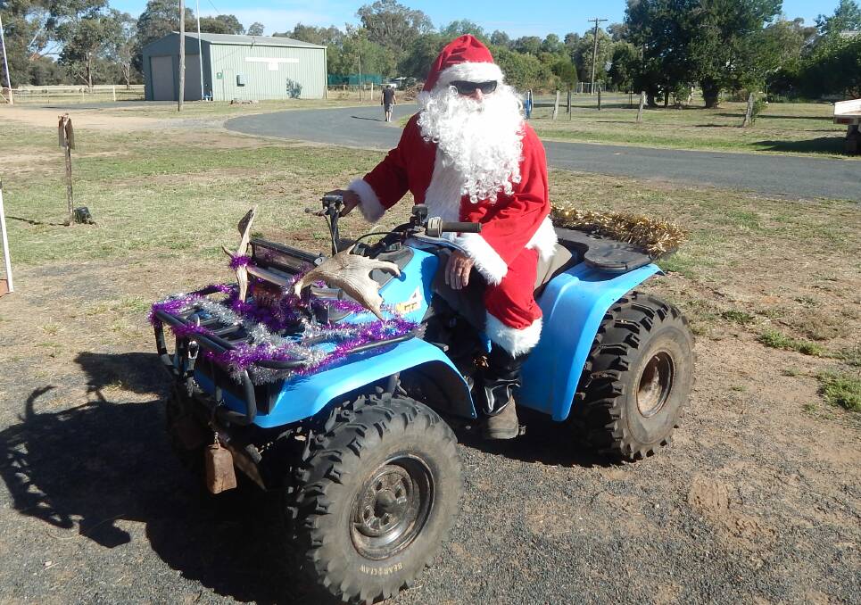 Santa Claus paid a visit to the children at the Greenethorpe Public School P&C fundraiser on this modified sleigh. 