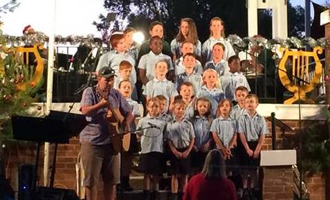 Students from St Joseph's Primary School during their 2016 Christmas Carols in the Park performance, Photo P Moore.