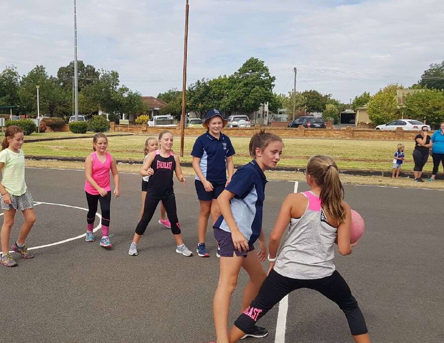 The juniors are having a blast playing competition netball. Photo P Wood.