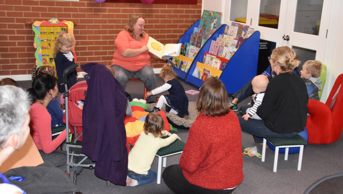 Librarian Erica Kearnes reads to pre-schoolers. 