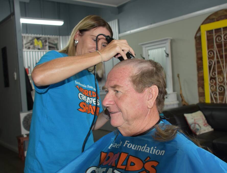 Almost there....Cindy Lawler shaves Jim Griffiths' head for The World's Greatest Shave on Wednesday March 13 at Loxley Salon. 